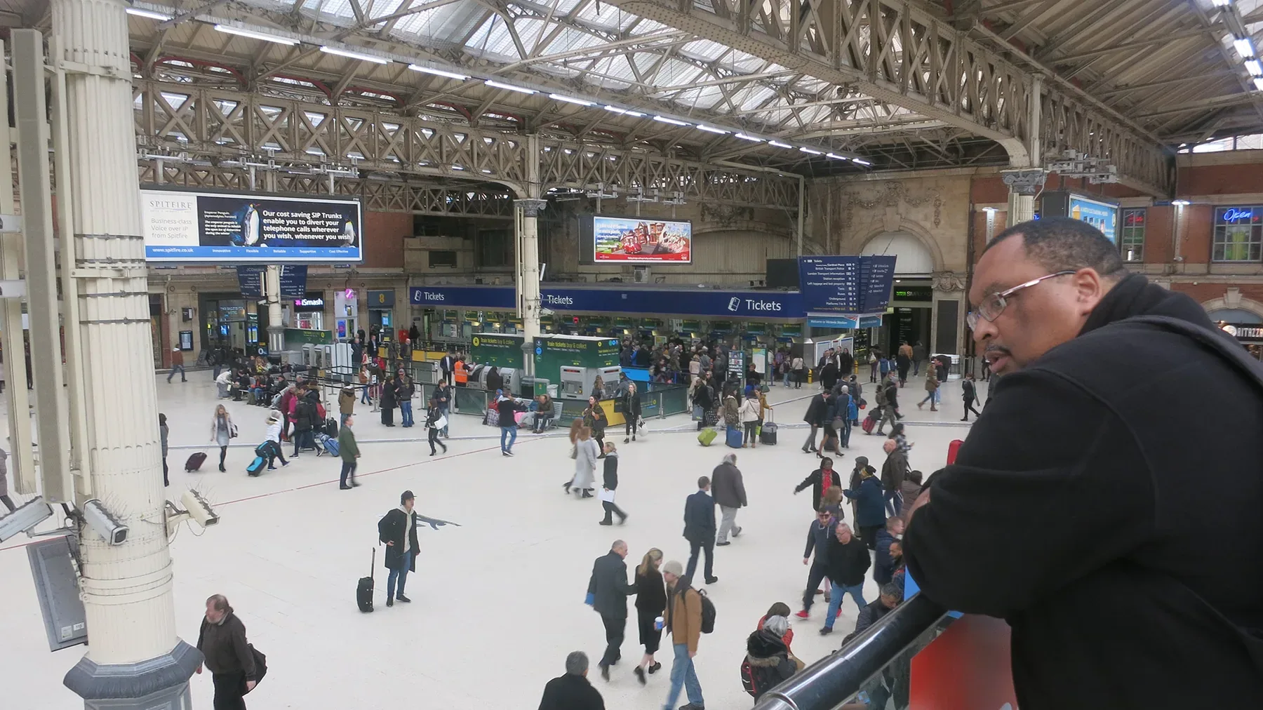 Passengers observed waiting at station concourse